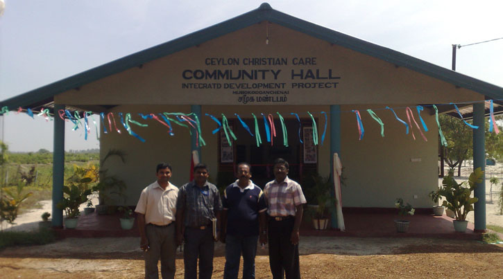 Local staff in front of the Community Hall, CCC:LoH, Sri Lanka